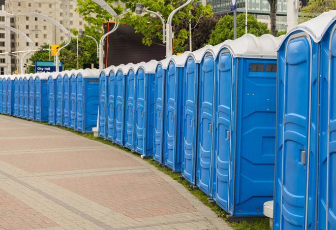 portable restrooms lined up at a marathon, ensuring runners can take a much-needed bathroom break in Farmingdale